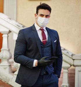 thumb business man wear suit with medical face mask mobile phone hand mers cov novel coronavirus 2019 ncov 151355 5400