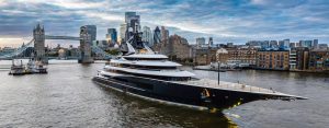 kismet yacht moored in fronttower bridge with london skyline in the background